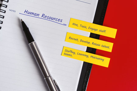 "Personal Planner for Productivity and Organization" - A personal planner with handwritten notes on a red background for productivity and organization in human resources.の写真素材