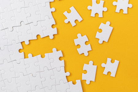 Almost Complete Jigsaw Puzzle with Scattered Missing Piecesの写真素材
