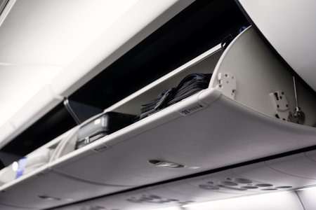 Overhead storage for luggage on airplaneの写真素材