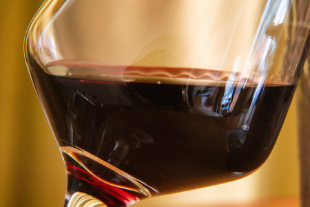 A close-up of a glass of red wine, showcasing its deep, rich color and inviting aroma.の写真素材