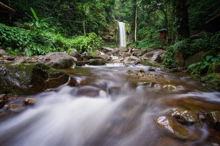 Serene Mahua Waterfall with smooth water flow and green surroundings. Tambunan, Sabah, Malaysia Borneo.の写真素材