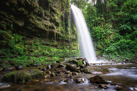 Serene Mahua Waterfall with smooth water flow and green surroundings. Tambunan, Sabah, Malaysia Borneo.の写真素材