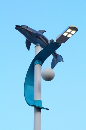 The modern Dolphin street light and blue skyの写真素材