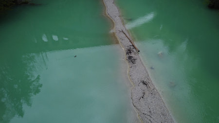 Swimming Duck Aerial View of Emerald Green River and Sand.