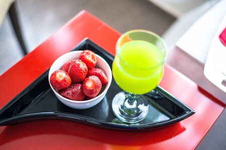 strawberries and a glass of juiceの写真素材