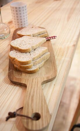 Wholewheat bread on wood cutter
