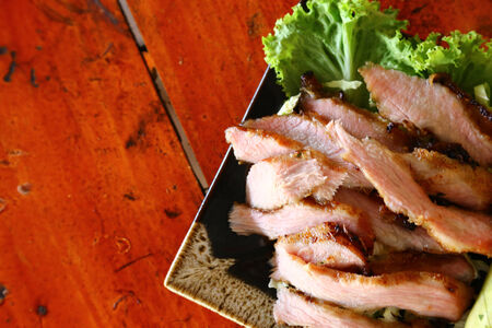 Slice roasted pork on plateの写真素材