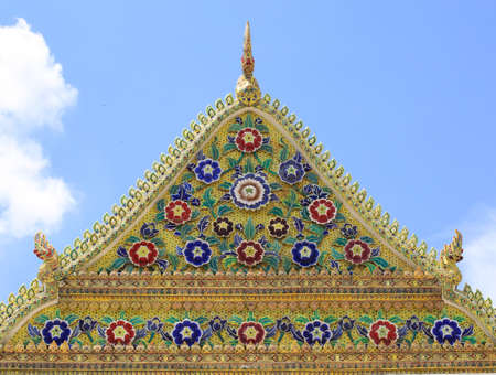 colorful porcelain on temple's roofの写真素材