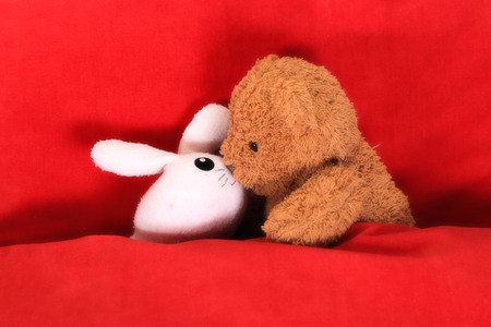 Teddy bear and rabbit doll in loveの写真素材