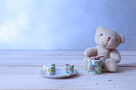 teddy bear with tea set in cool toneの写真素材