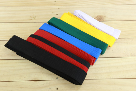 Color belt of martial art on wood floorの写真素材