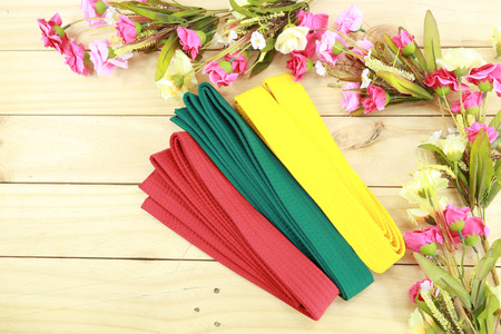 Color belt of martial art on wood floorの写真素材