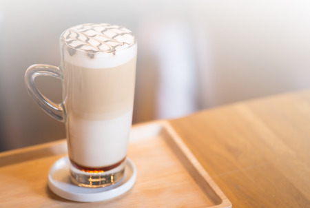 coffee caramel macchiato in tall glass with layerの写真素材