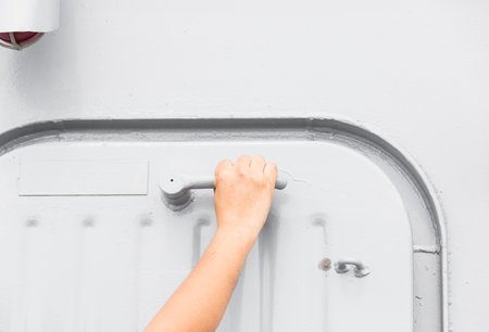 Hand open grey steel safter door industry or big boatの写真素材