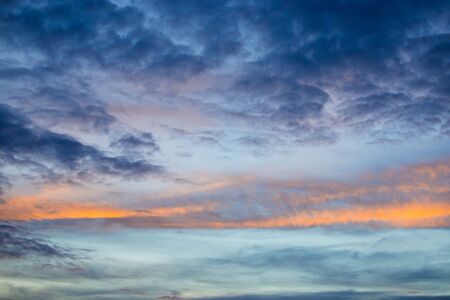 Sky and cloud at sunset with dark and vibrant light at  dusk