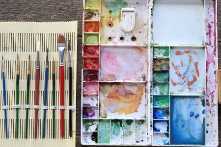 Watercolor brushes and color tray for art and paint. Watercolor Artist equipment for artworkの写真素材