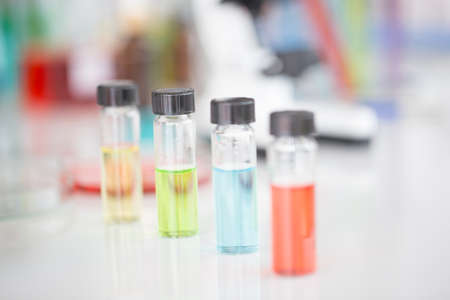 Chemical tube set development and pharmacy in laboratory with green bokeh through windowsの写真素材