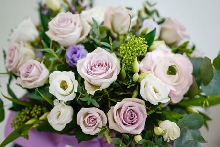 A bouquet of delicate fresh flowers in lilac tonesの写真素材