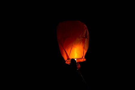 Sky lantern lanterns are being made to illuminate the darkness of nightの写真素材