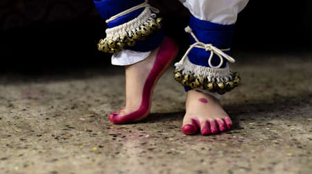 Close up of feet an Indian classical dancer wearing ghungroo or a musical anklet - group of small...