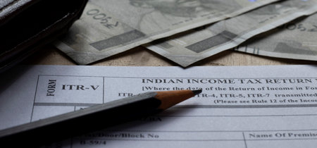 Birbhum, West Bengal / India - 31st August 2020: Aadhaar card identity of India held in hand by an...