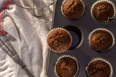 Top view of a tray full of homemade chocolate muffin cup cakeの写真素材