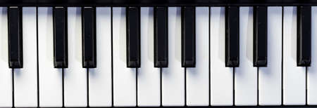 Top close-up view of keys of piano or keyboard