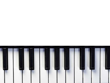 Top view of piano or keyboard in white backgroundの写真素材