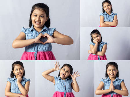Facial expressions collage of a pretty cute Indian girl child isolated on white backgroundの写真素材