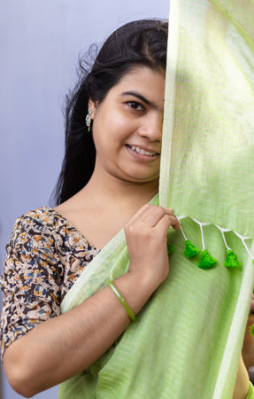 Portrait of a beautiful Indian woman in green sareeの写真素材
