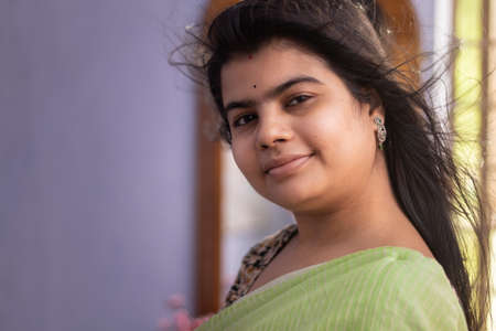 Portrait of a beautiful Indian woman in green saree
