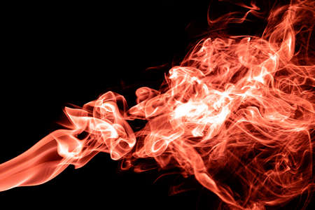 Red color abstract smoke on black backgroundの写真素材