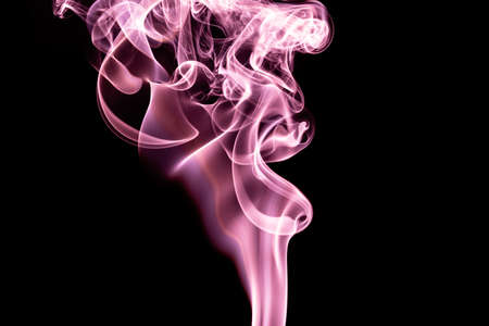 Pink color abstract smoke on black backgroundの写真素材