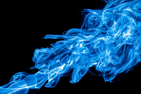 Blue color abstract smoke on black backgroundの写真素材