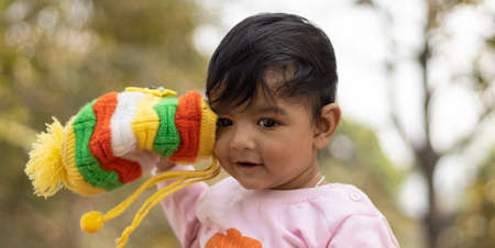 An Indian cute baby boy smiling in green backgroundの写真素材
