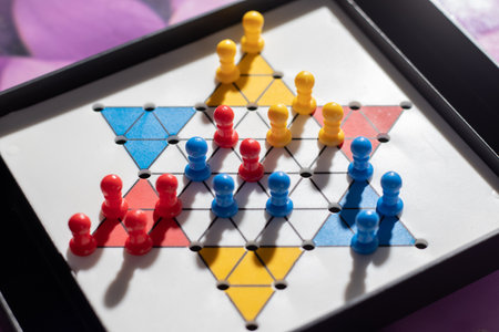 Selective focus on a chinese checker indoor game boardの写真素材