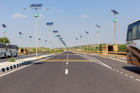 Number of street lights with solar panel during day time on blue sky background in Rajasthanの写真素材