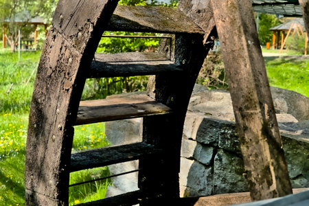 Old water wheel in the village, close-up, selective focus