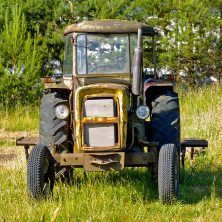 An old farm tractor. View of headlights and cabinの写真素材
