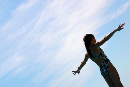 Girl preparing to do a backdiveの写真素材
