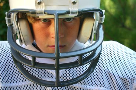 young boy in football uniformの写真素材