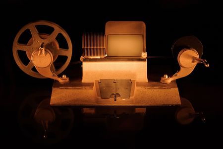 A old fashioned film editor shot on black with very dramatic lightingの写真素材
