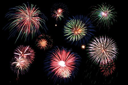 A grouping of fireworks in a black skyの写真素材