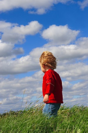 Young boy standing in a fieldの写真素材