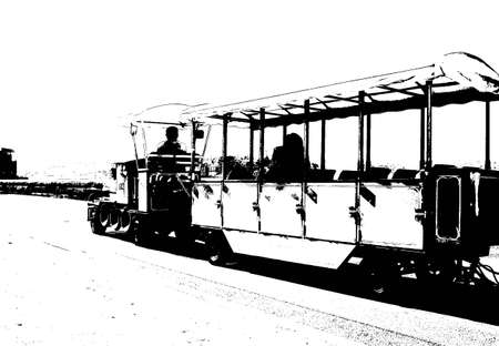 Black and white picture of a mini train carrying passengers. Gives the feeling of a drawing or etching of times past.の写真素材