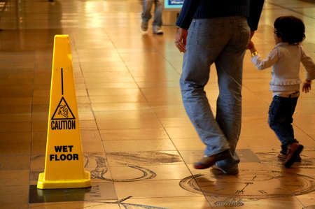 Caution Wet Floor sign in a shopping mallの写真素材
