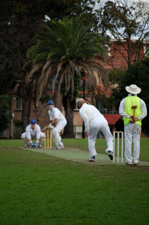 A cricket bowler bowls to a batsmanの写真素材