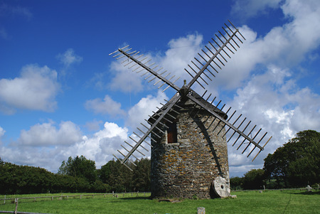 windmill in a green field in Britany (France)