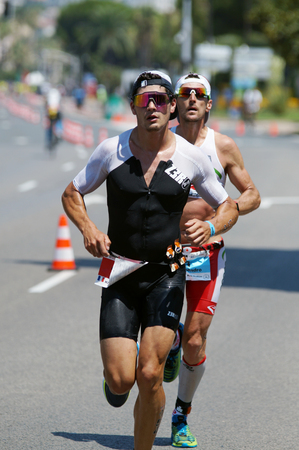 NICE - JULY 27, 2017: IRONMAN Nice 2017. Competitor during the Marathon.のeditorial素材