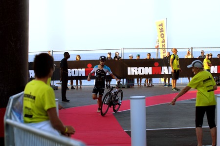 NICE - JULY 27, 2017: IRONMAN Nice 2017. MIKA Tomas finishing the swimming and starting for the 180 km bike tourのeditorial素材